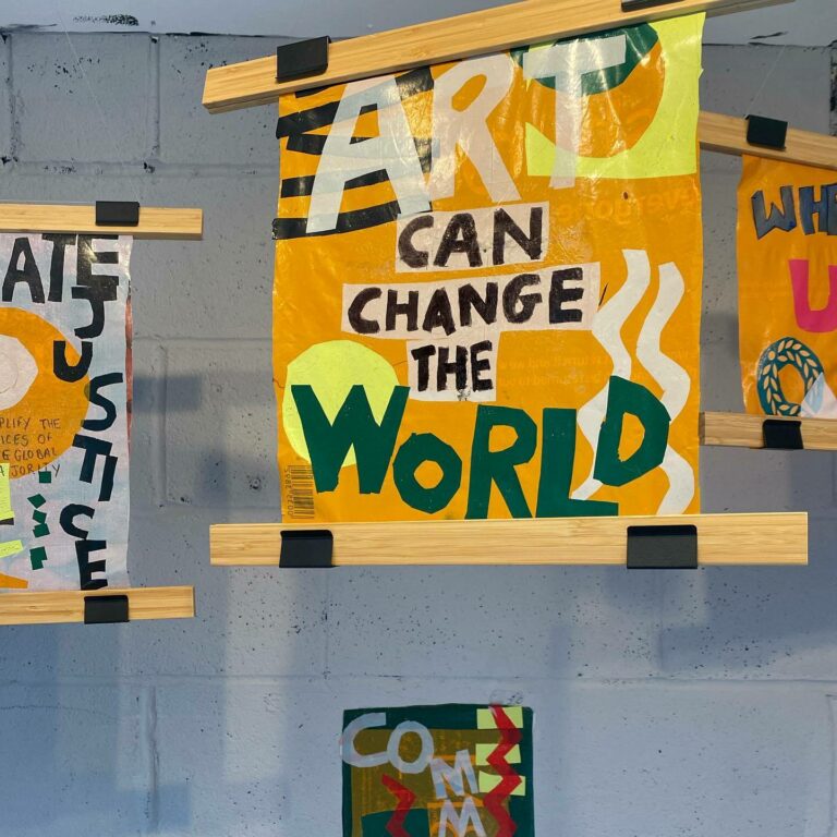 Banner reading Art can change the World