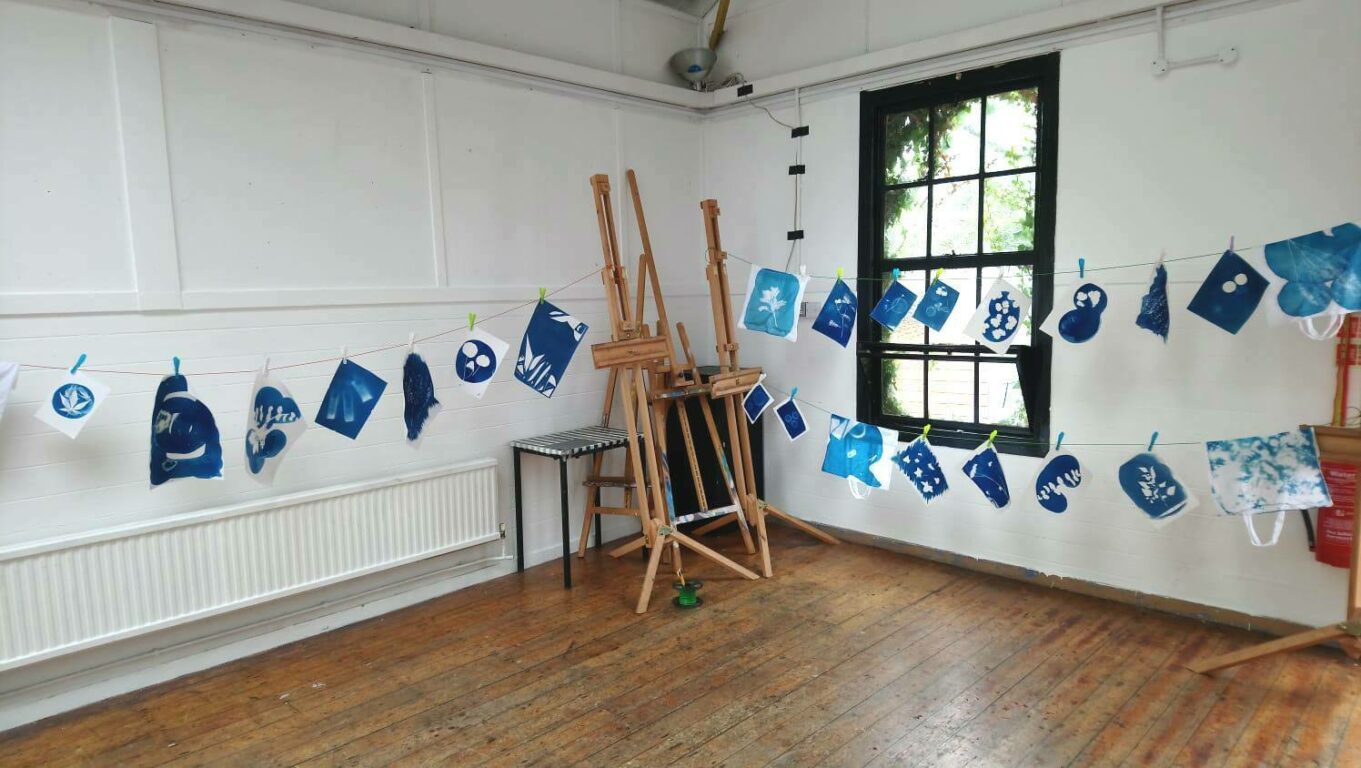 Cyanotypes hanging to dry in Fusion building