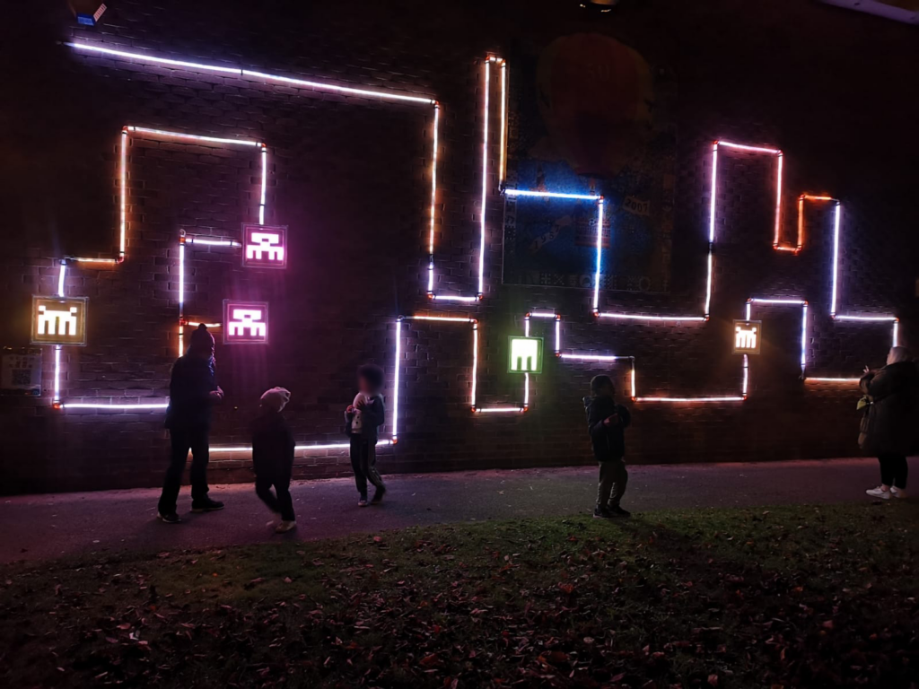 People interact with the responsive LED artwork